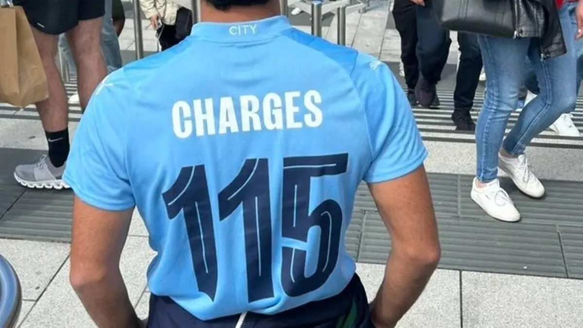 A Manchester City shirt with Charges 115 on the back.